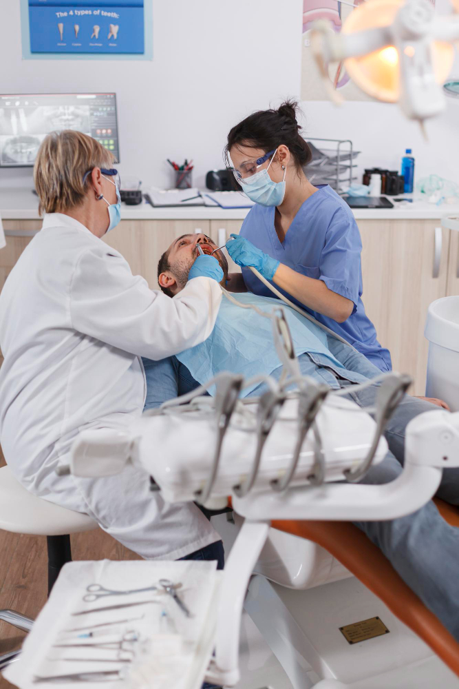 2 dentists with patient