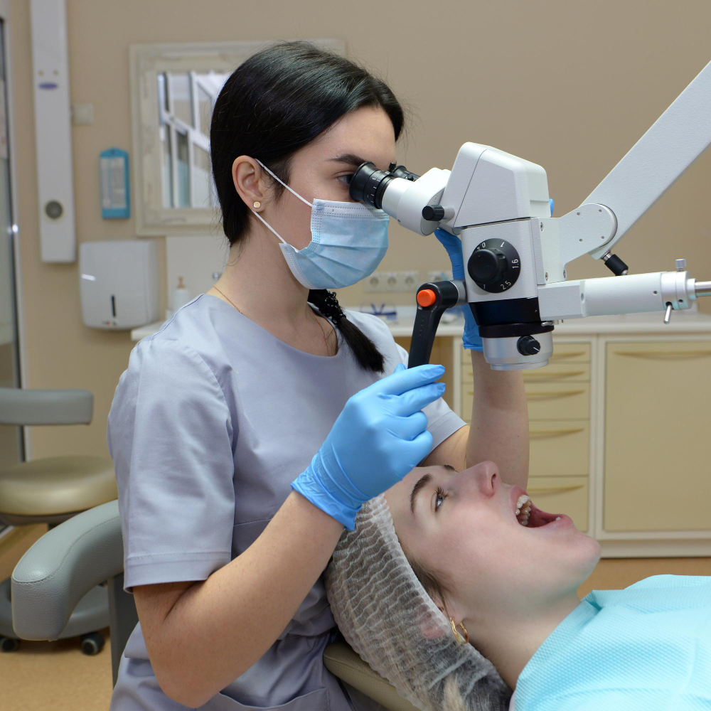 dentist performing mouth cancer screening to patient 1