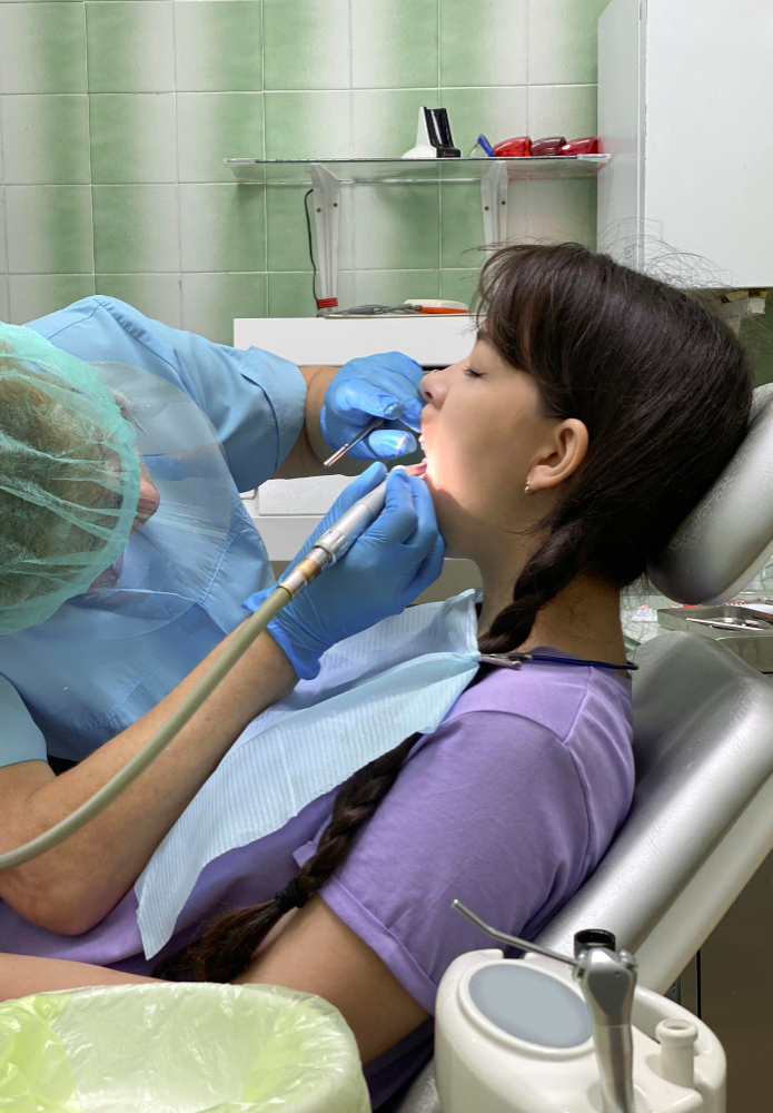 woman during dental treatment with dentist
