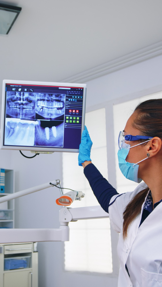 dentist looking at dental xrays