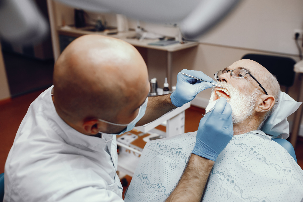 man in mid 60s getting dentlaa treatments