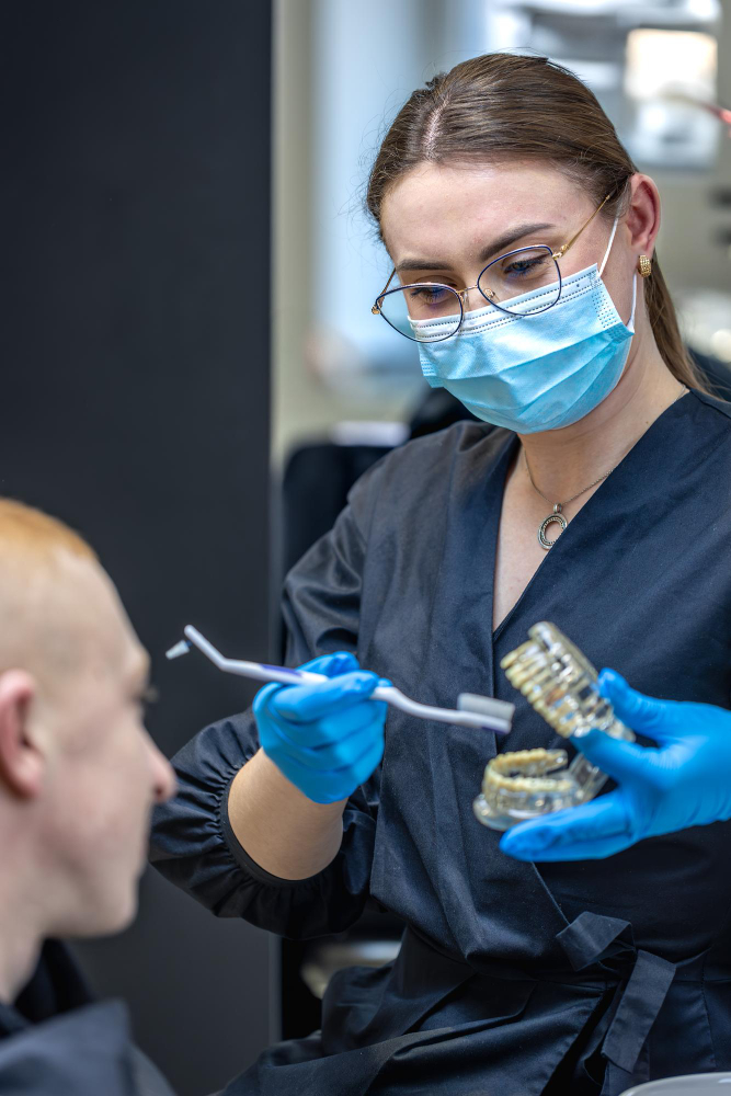 man listening to dentist