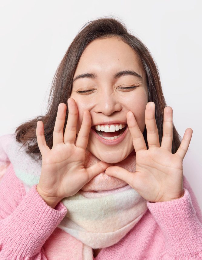woman smiling happy closed eyes